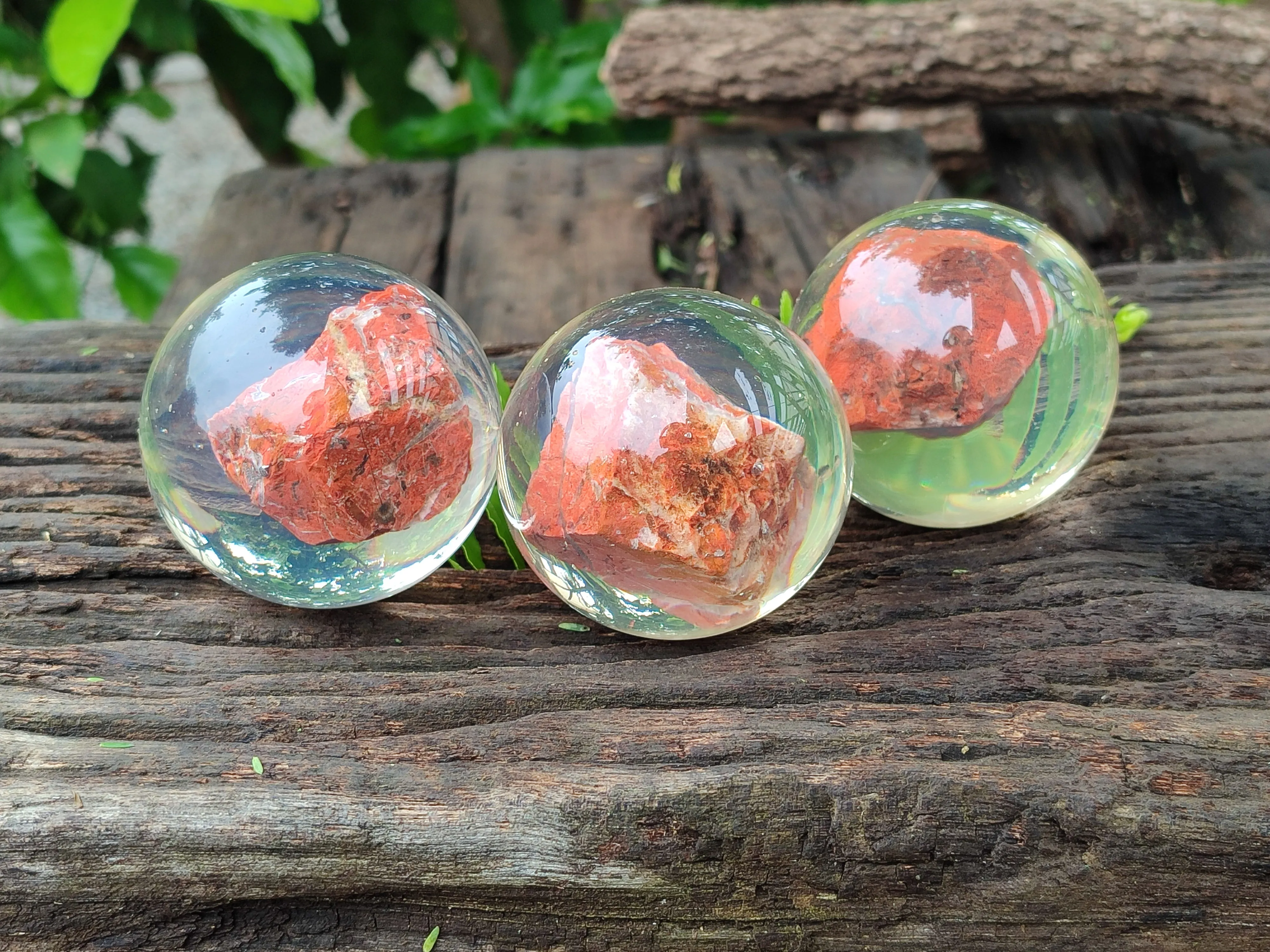 Polished  Brecciated Red Jasper cobbed piece in PVC Resin Sphere - sold per item - From Northern Cape, South Africa